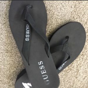 Guess brown flip flops
